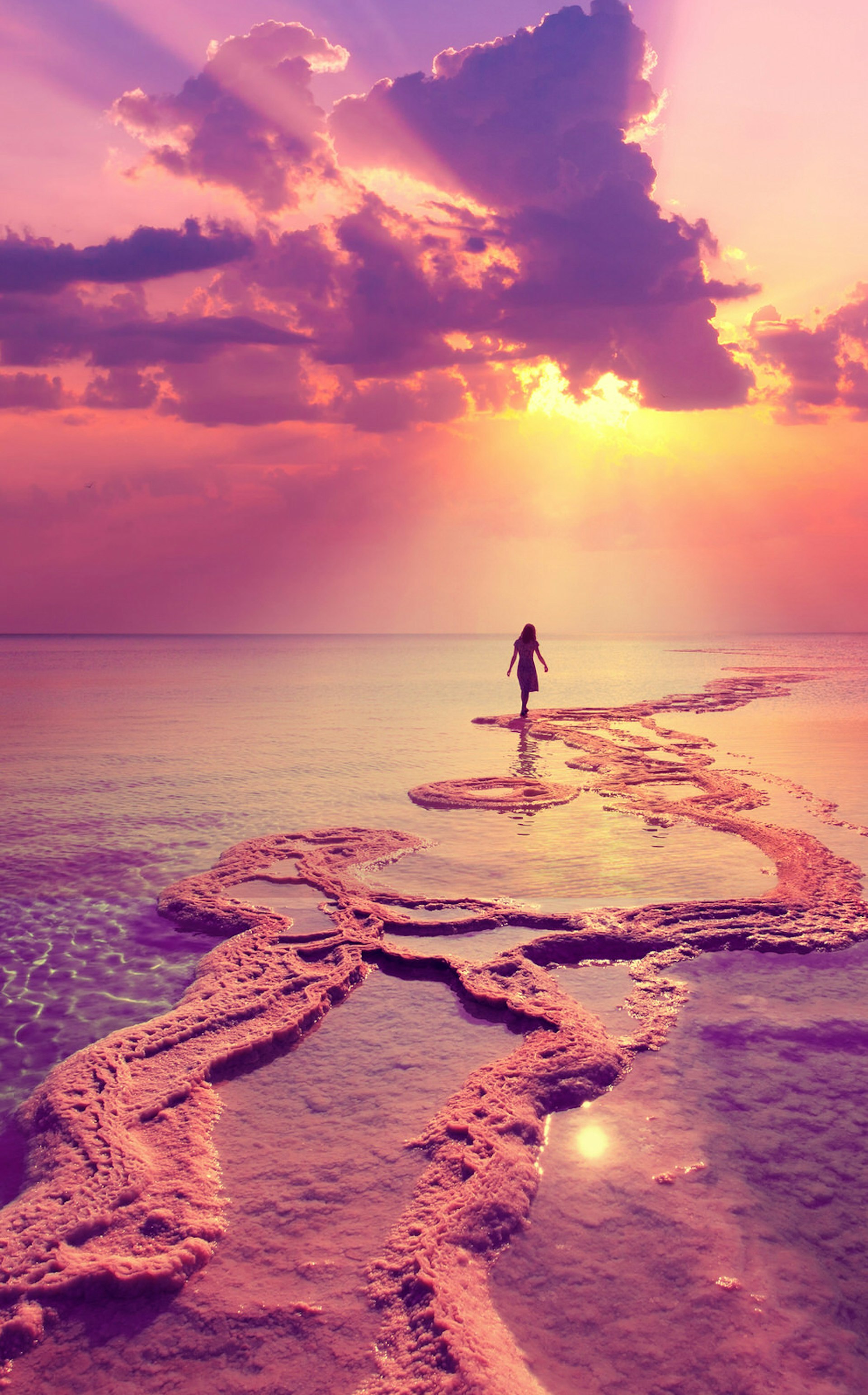 Silhouette of young woman walking on Dead Sea. Image by vvvita / Shutterstock
