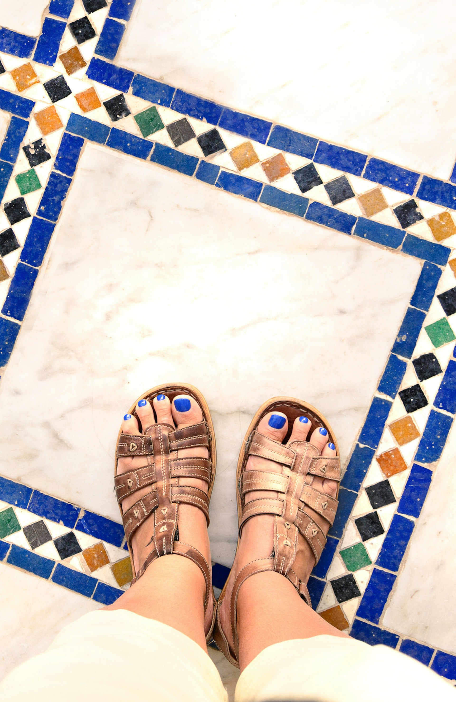 Sandals on North African tiles. Image by Ser Borakovskyy / Shutterstock