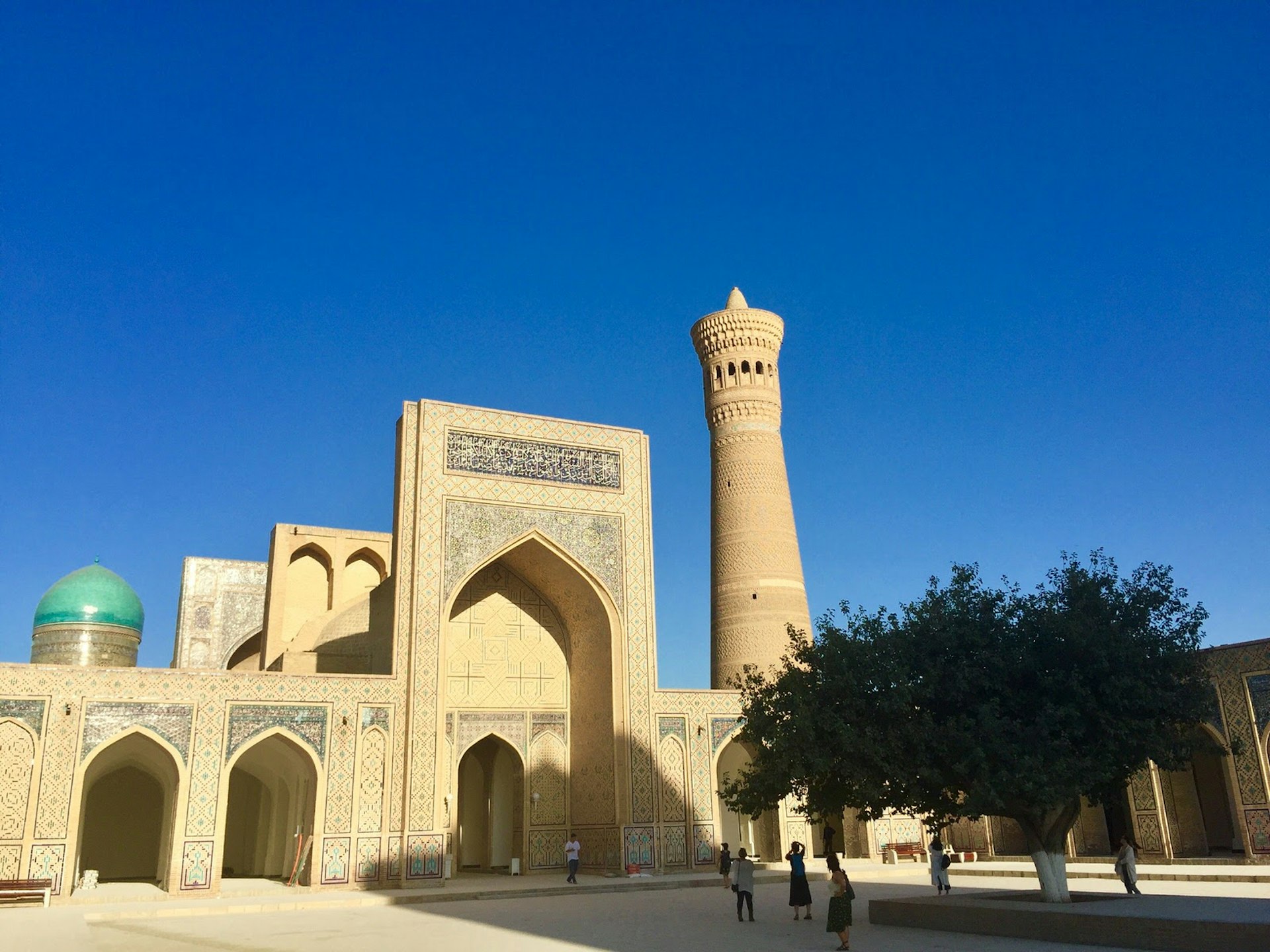Bukhara's Kalon Mosque and minaret against a blue sky