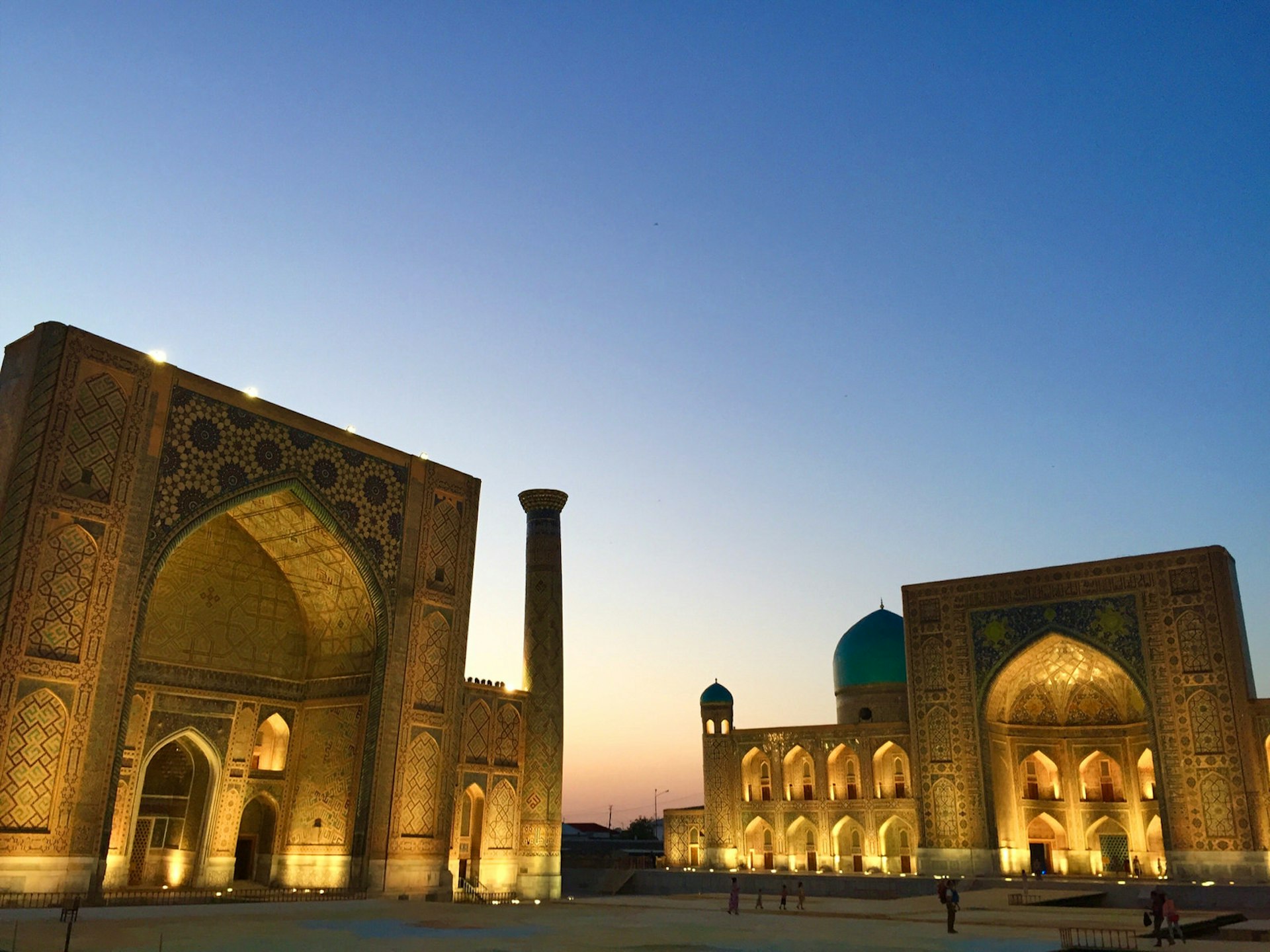Samarkand's illuminated Registan Square at dusk