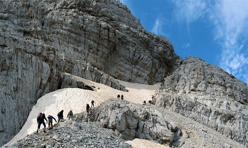 A group of hikers ascend a mountain in Albania