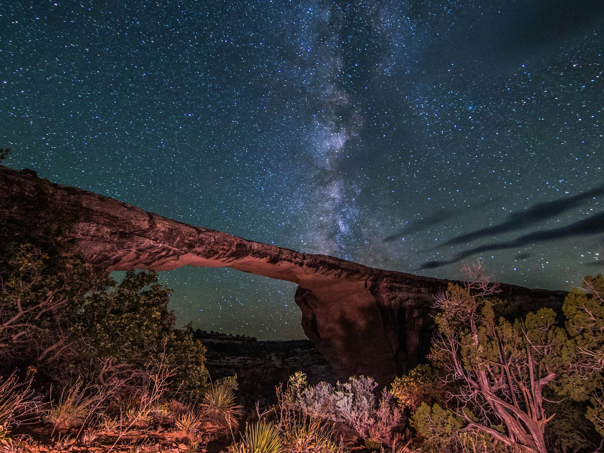 The Milky Way as seen through a sandstone bridge; Stargazing Southwest USA
