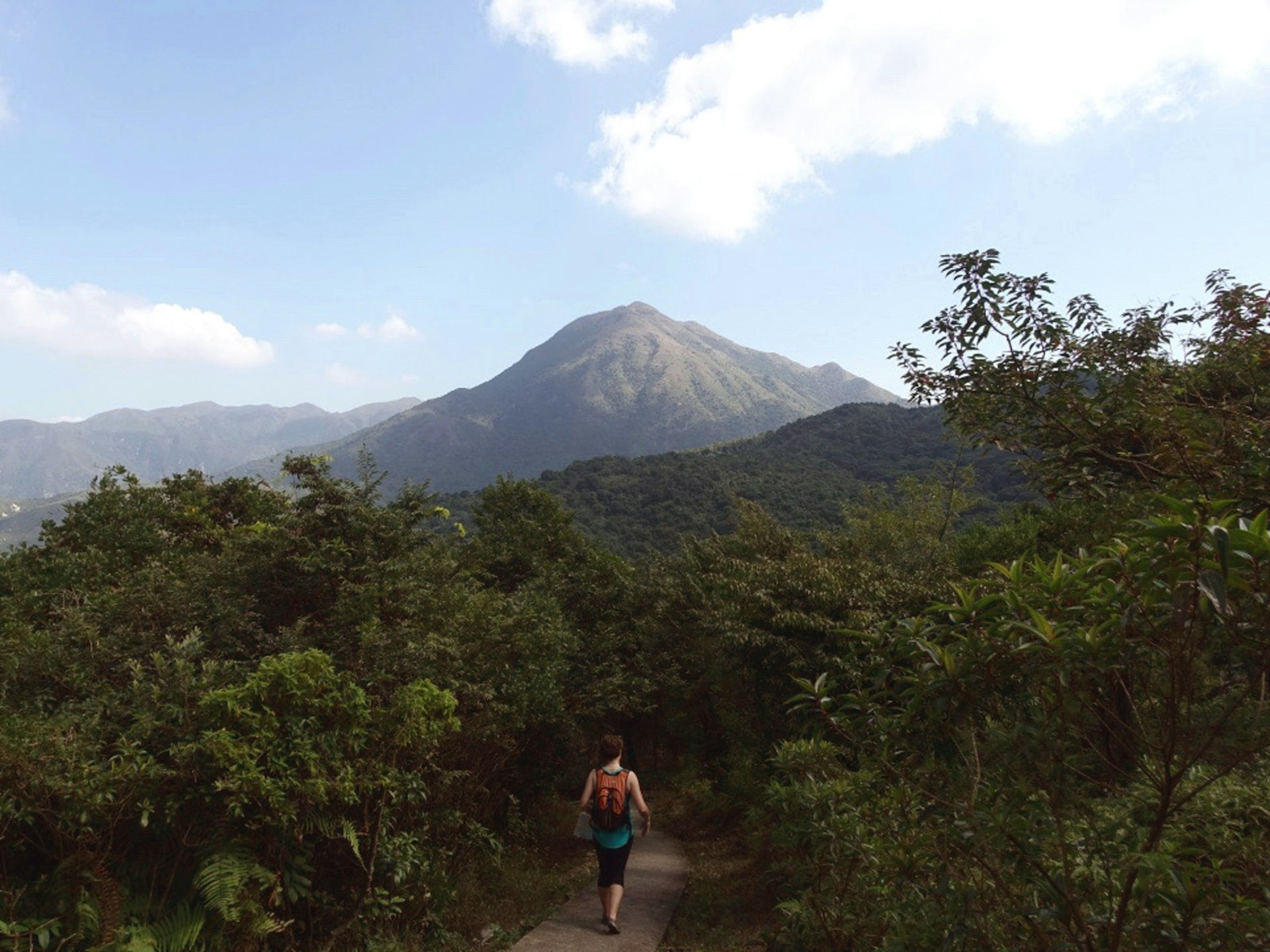 Hiking in the shadow of Lantau Peak is challenging and rewarding © Tess Humphrys / Lonely Planet