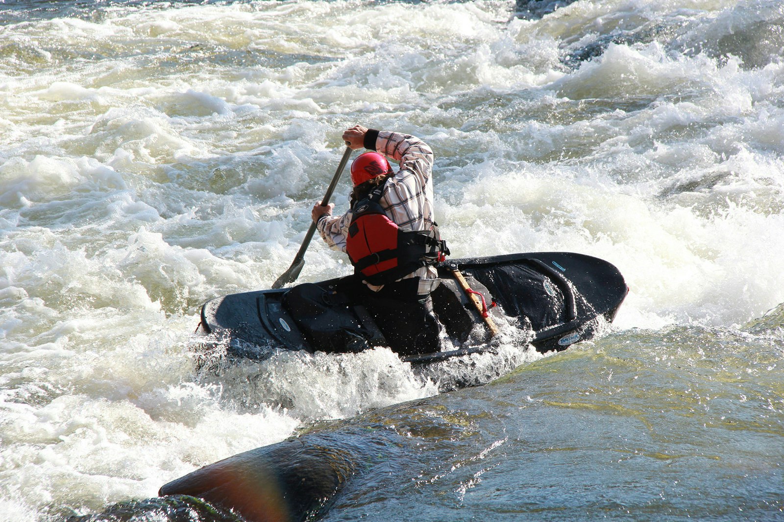 kayaker fights rapids on the James River in Virginia