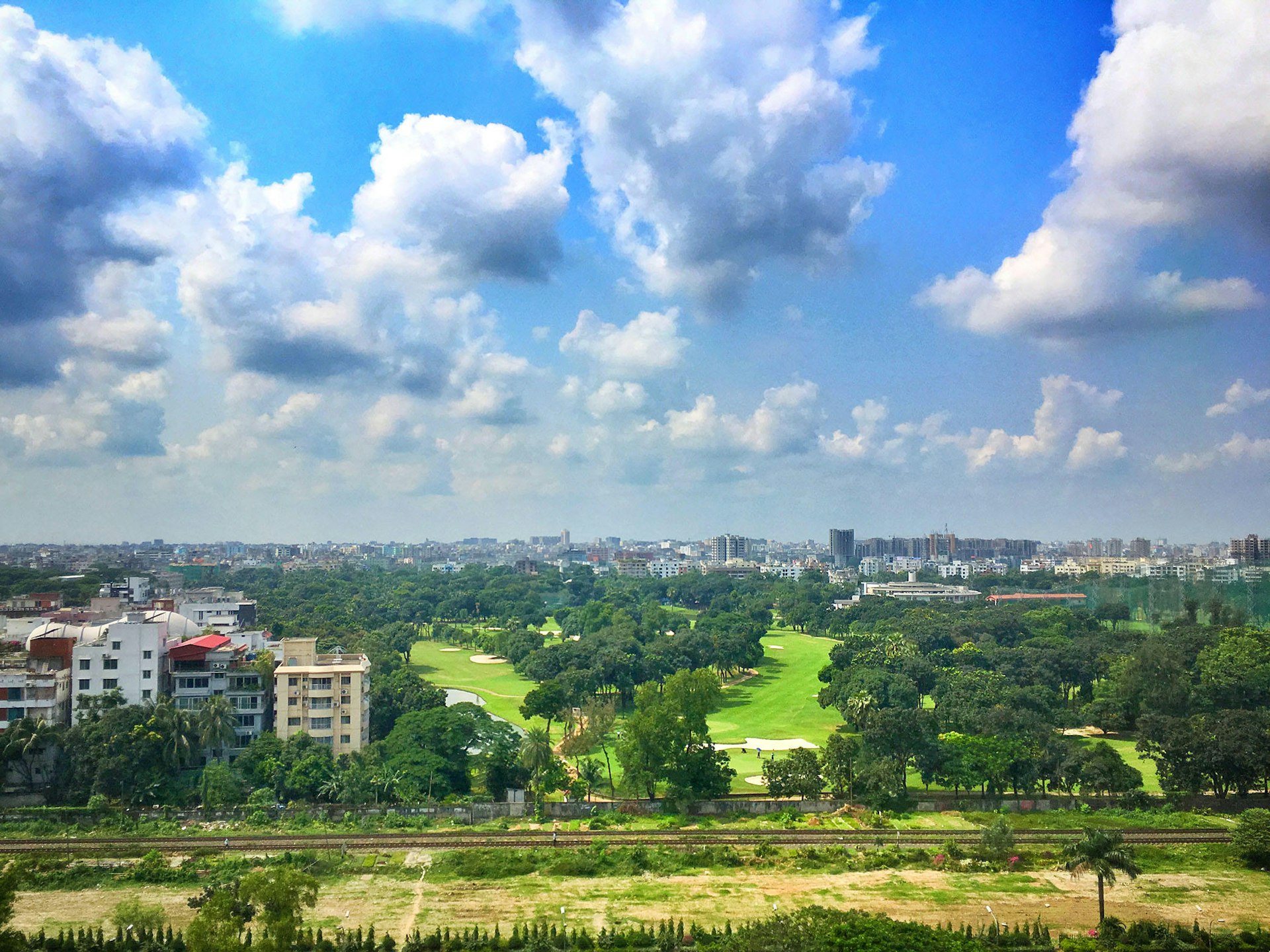 Clouds blow over Dhaka's urban greenery