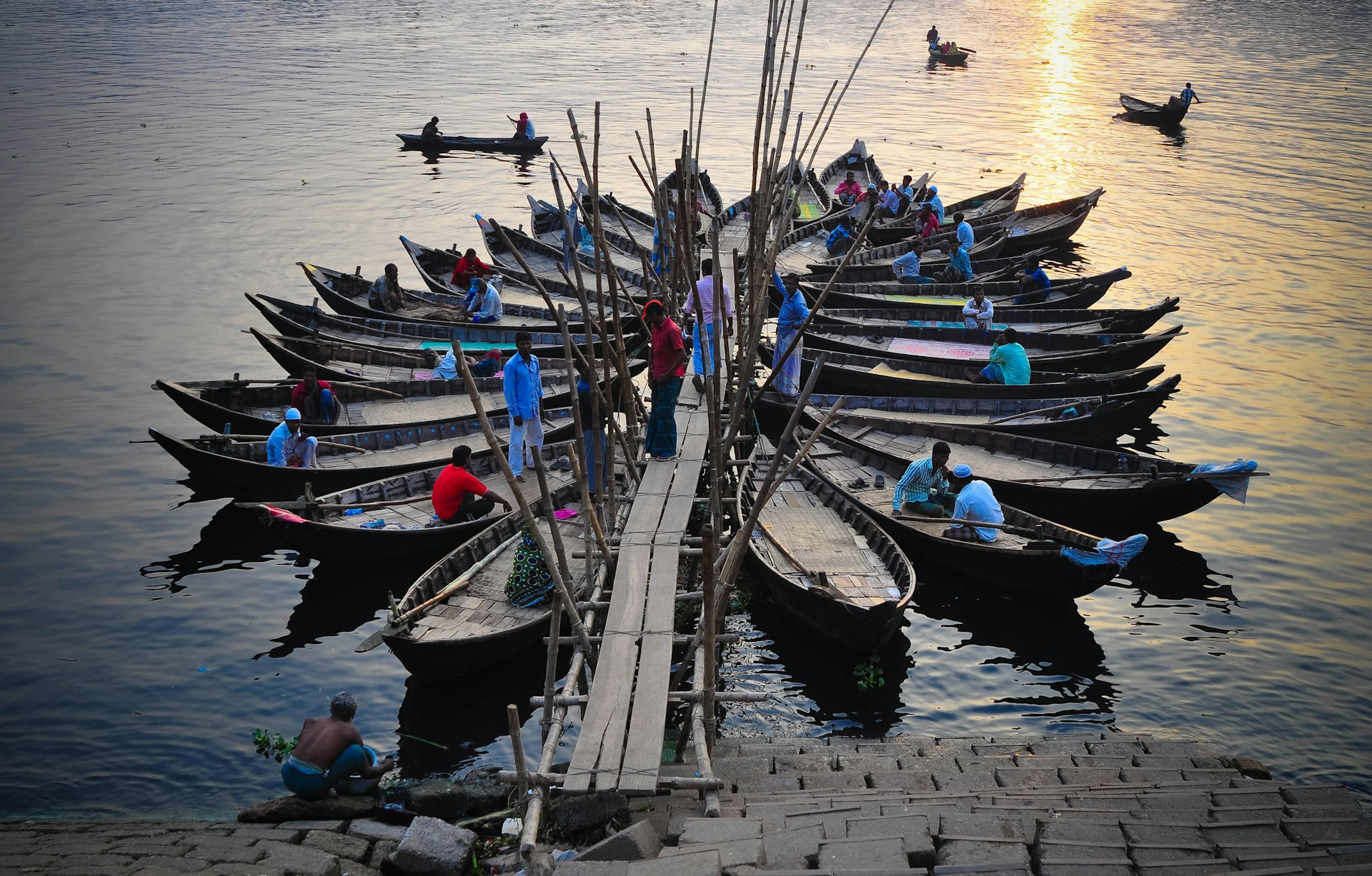 Small boats create a sculptural form at sunset