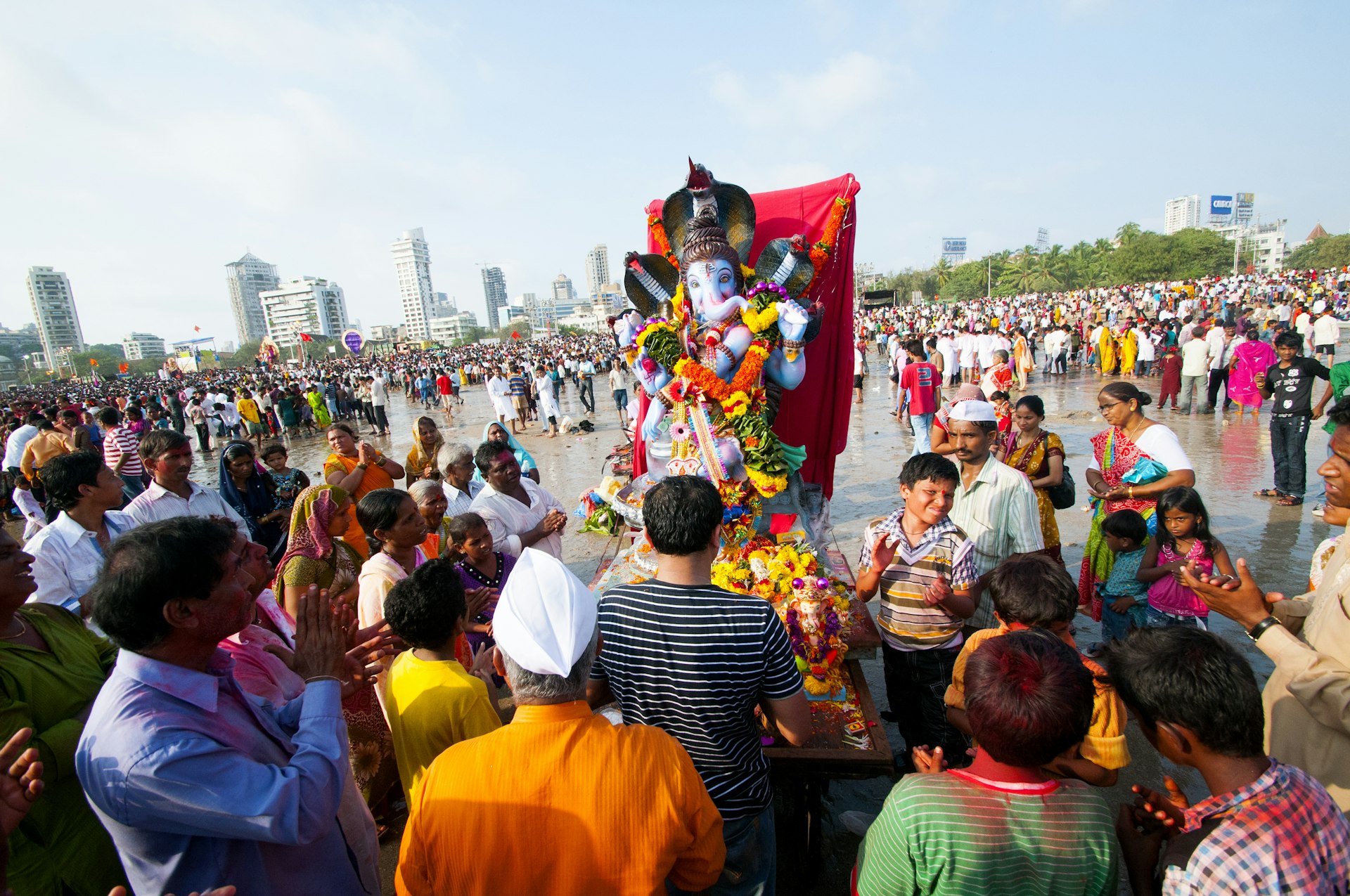 Devotees celebrate the festival of Ganesh Chaturthi at Girgaum Chowpatty beach