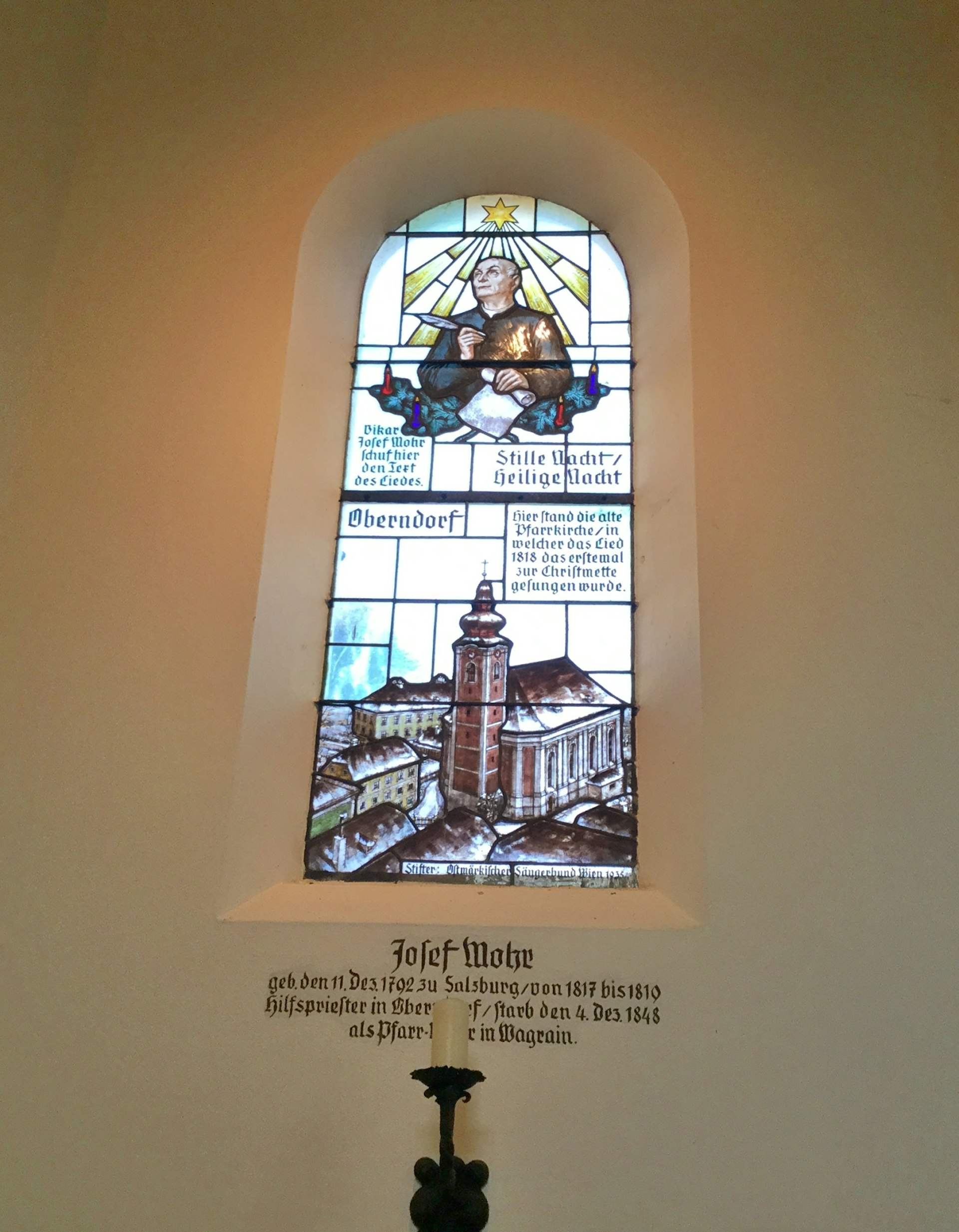 A stained-glass window in the Silent Night Chapel, Oberdorf depicting Joseph Mohr