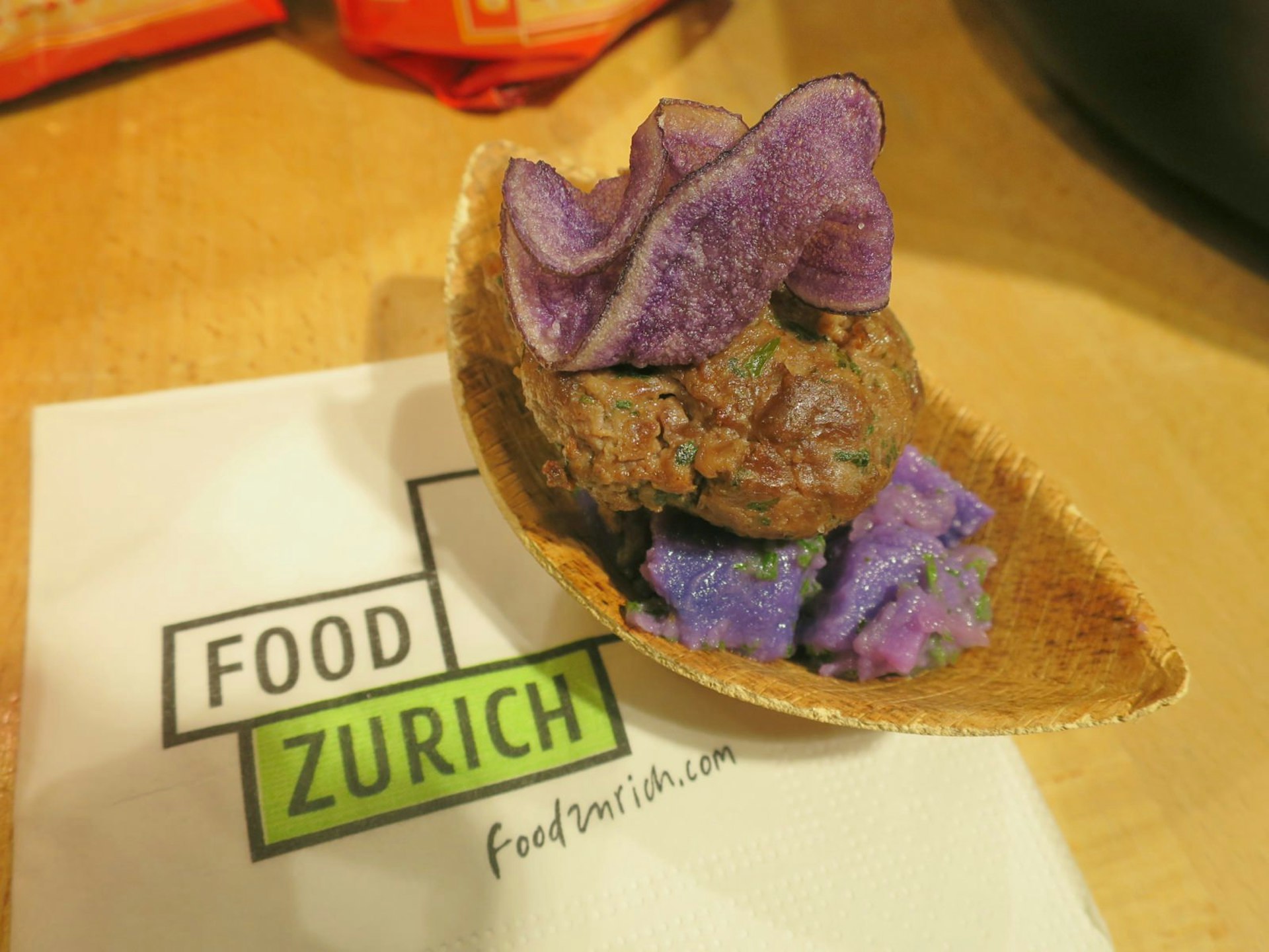 Meatballs and blue potatoes at the Food Zürich food festival in Switzerland © Karyn Noble / Lonely Planet