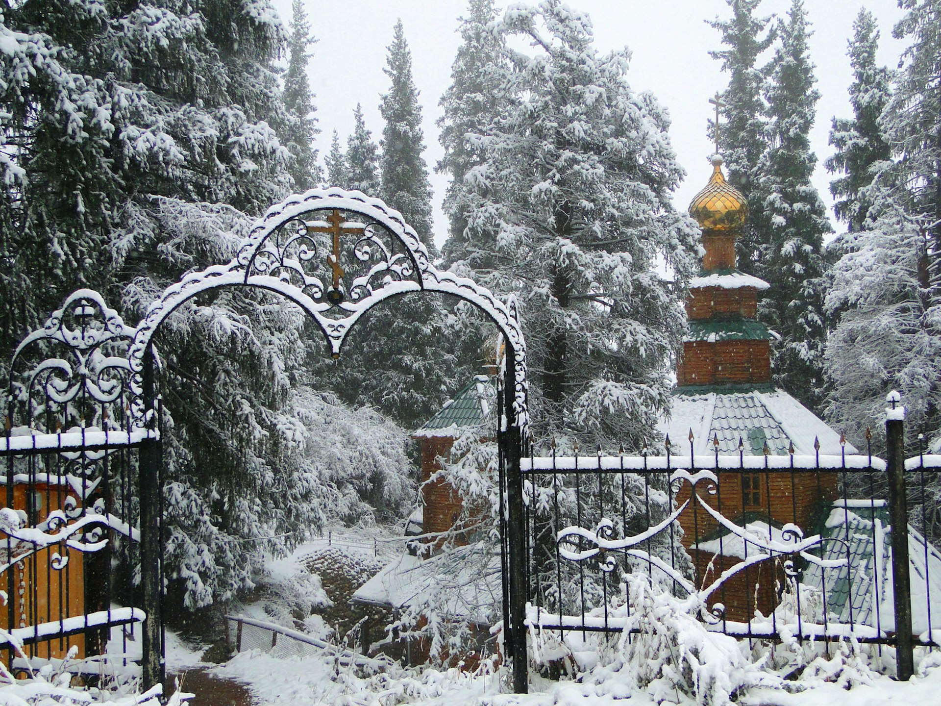 Features - Ak-Sai's small Russian Orthodox monastery after the first winter snow © Stephen Lioy / Lonely Planet