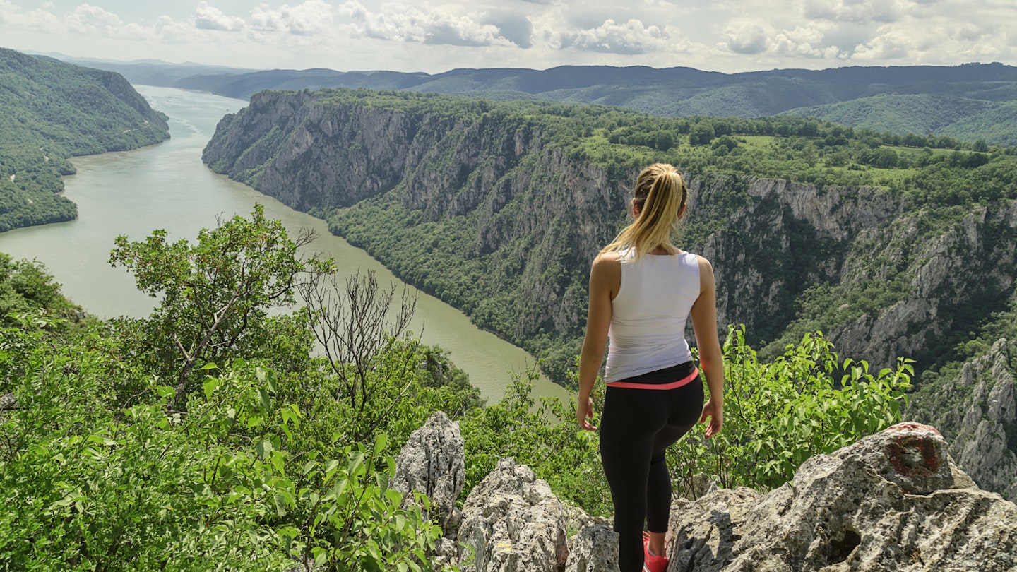 A hiker takes in the Danube views at the Iron Gates gorge in Djerdap National Park © Darko Manasic / Shutterstock
