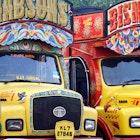 Features - India, South India, Kerala. Painted trucks parked in Cochin.