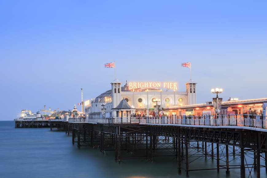 Brighton's pier lit up at dusk