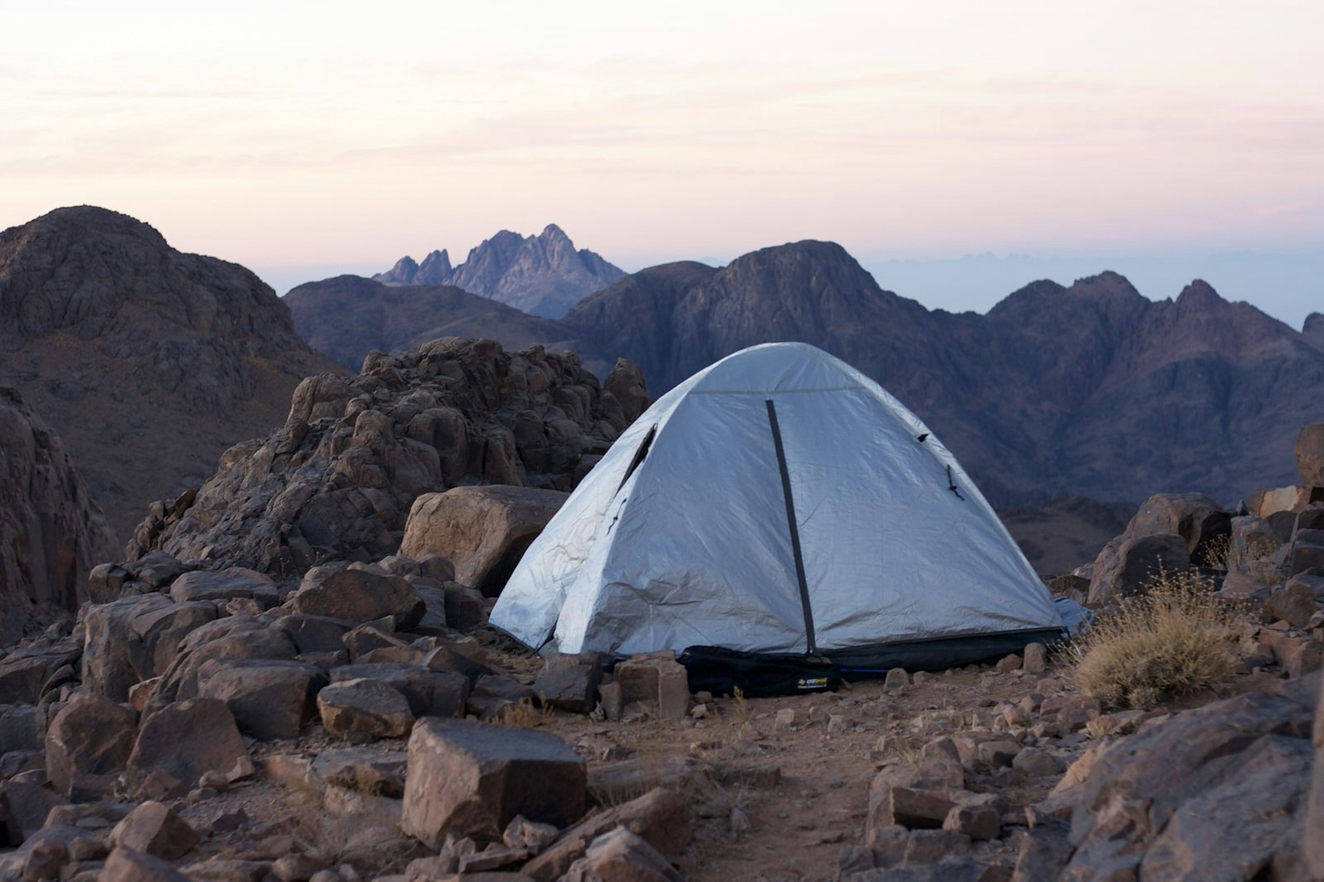 A tent pitched on a rocky hillside on the Sinai Trail © Jen Rose Smith / Lonely Planet
