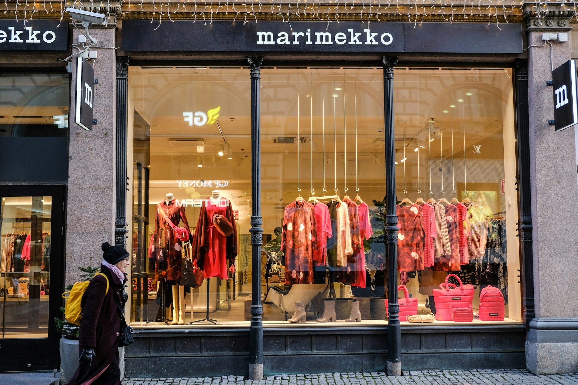 A woman walks past the window display of a Marimekko store in Helsinki © Tim Bird / Lonely Planet