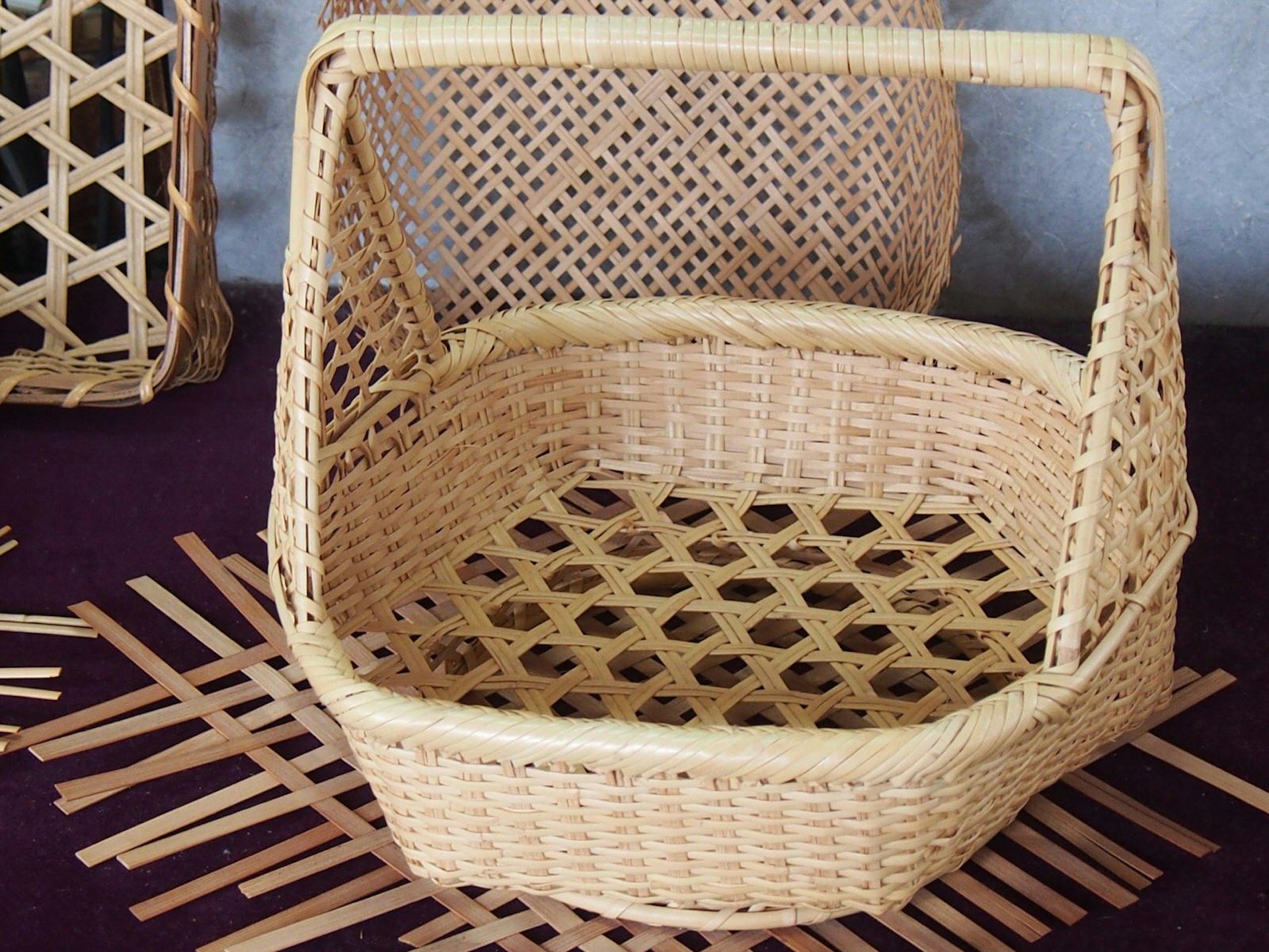 A complete handwoven bamboo basket on display © Manami Okazaki / Lonely Planet