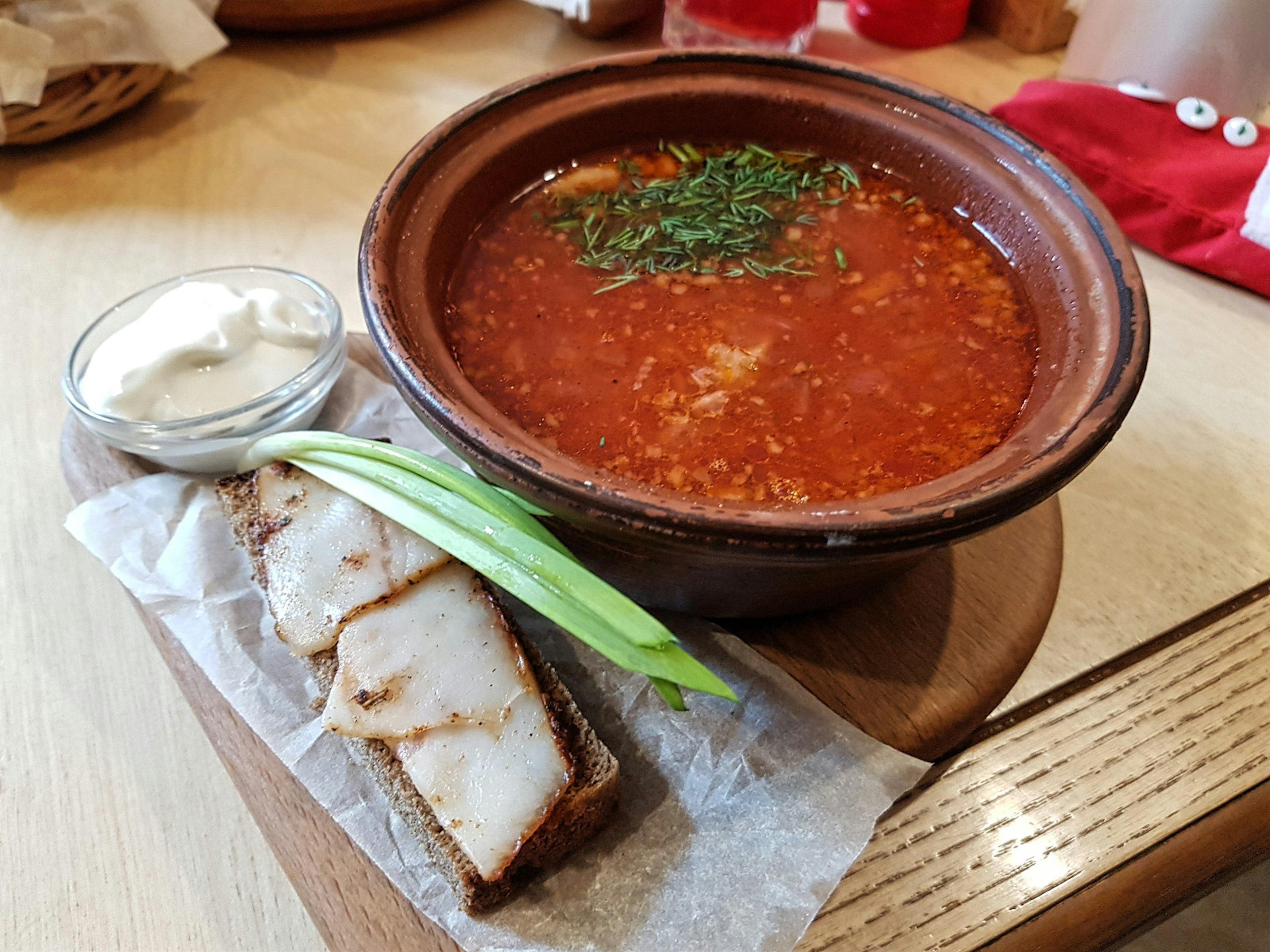 Traditional Ukrainian Borsch served with lard and sour creme © Pavlo Fedykovych / Lonely Planet