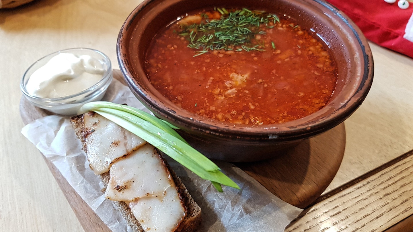 Traditional Ukrainian Borsch served with lard and sour creme © Pavlo Fedykovych / Lonely Planet