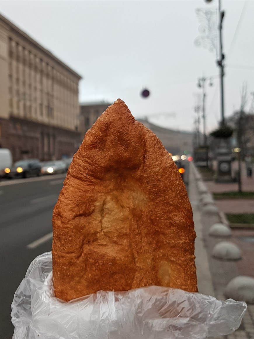 Perepichka (sausage in a fried dough), the iconic urban snack from Kyiv © Pavlo Fedykovych / Lonely Planet