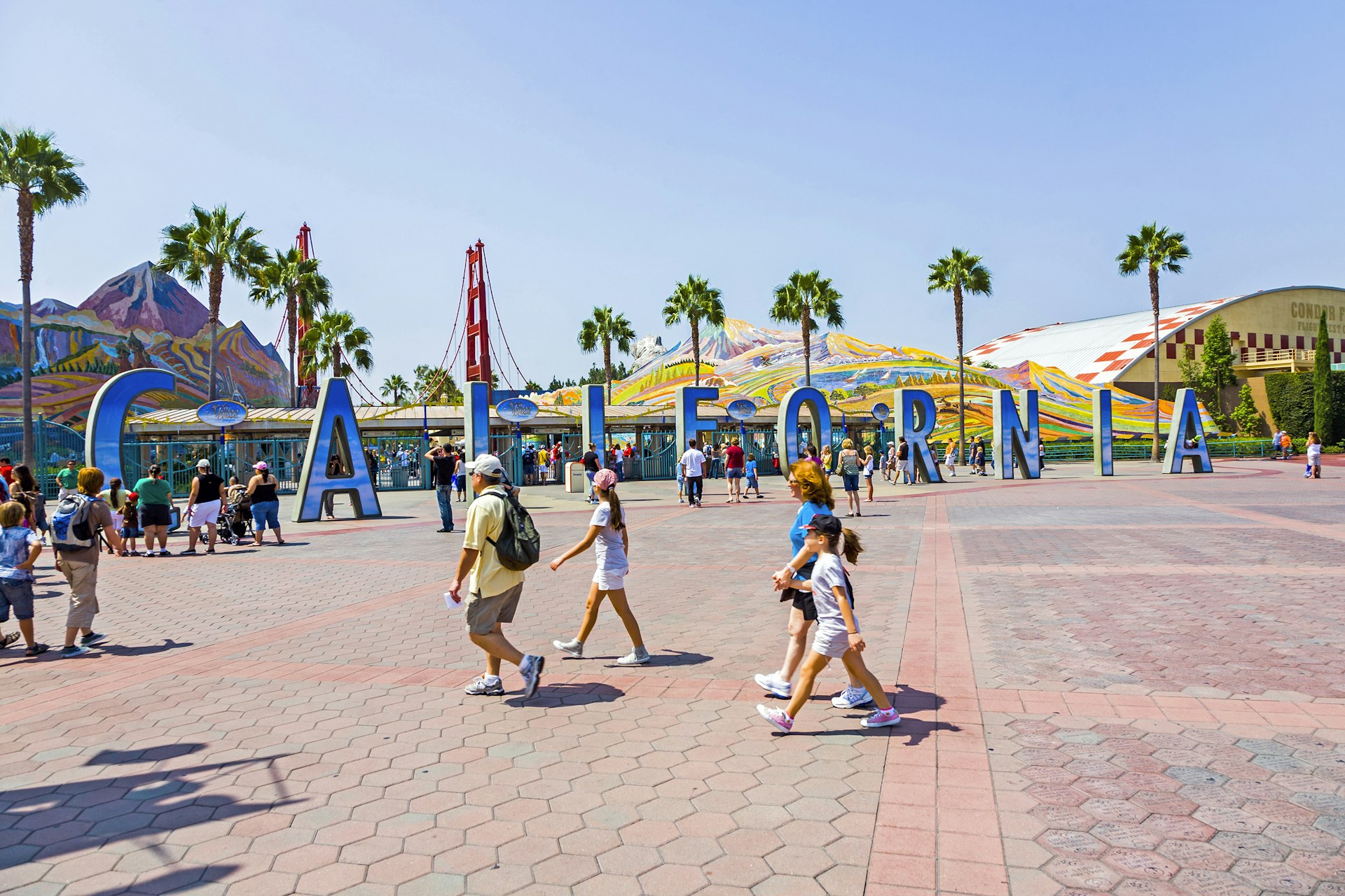 Features - people visit disneyland and walk over commemorative bricks with