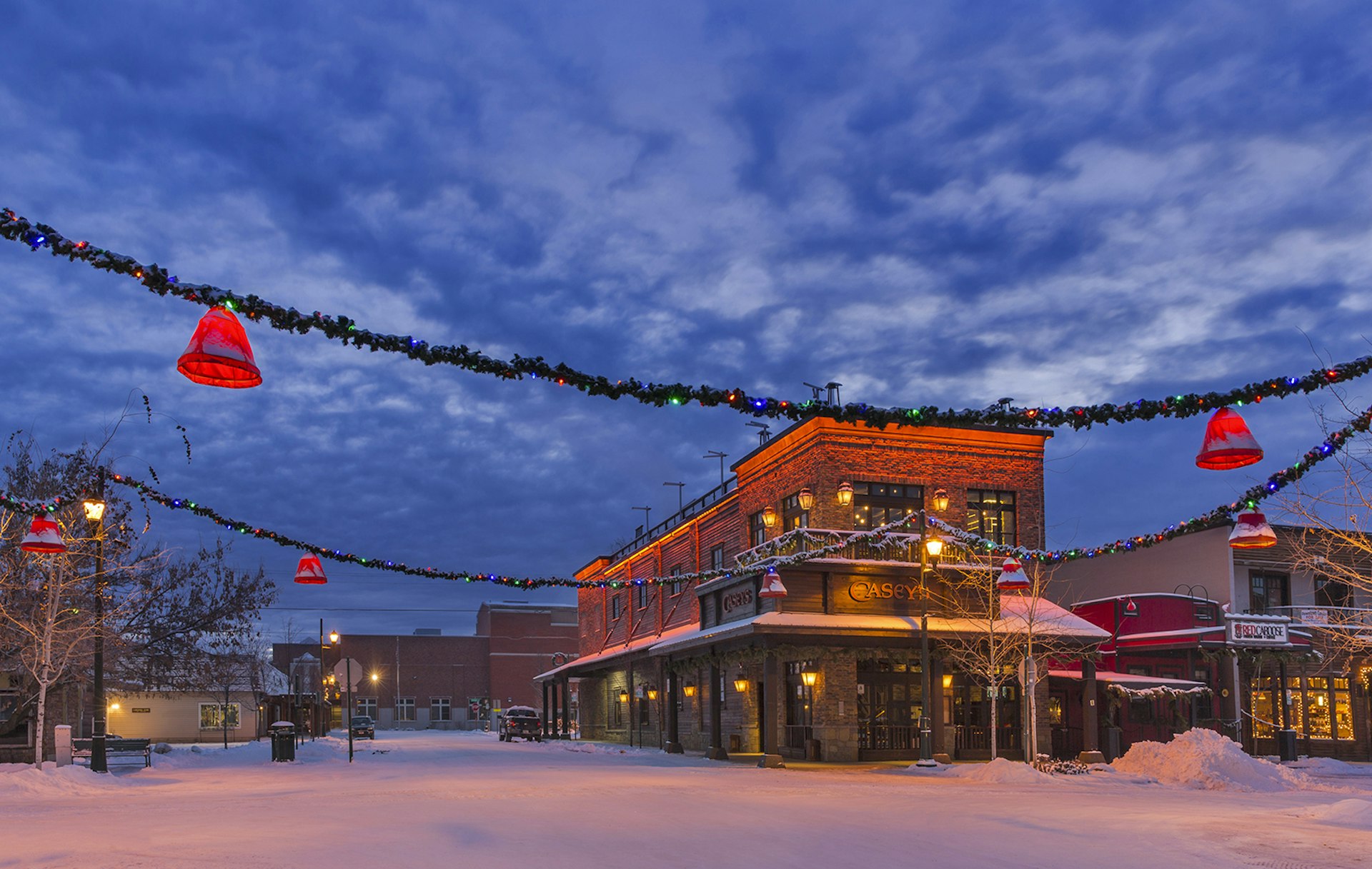 Features - Snowy winter morning along Central Avenue in downtown Whitefish, Montana, USA