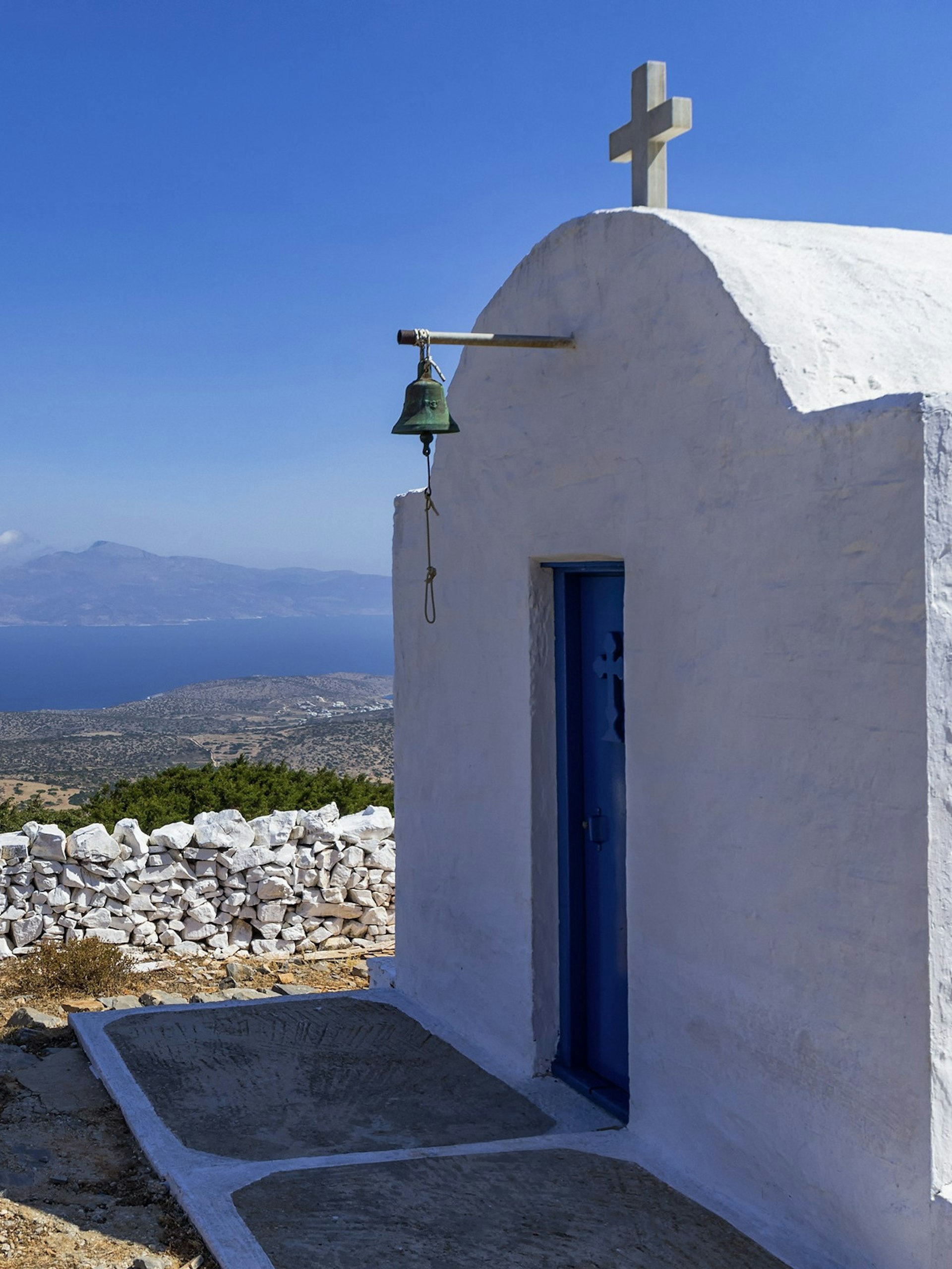 Solitary chapel on a hilltop overlooking Iraklia island © kokixx / Shutterstock