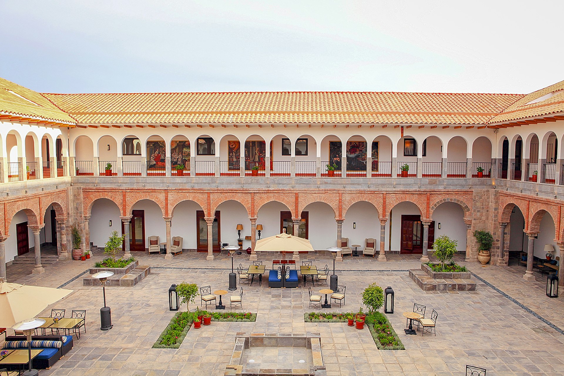 Features - South America, Peru, Cusco, the Marriott hotel, which is housed in a former Spanish convent, showing the view of one of the internal courtyard from a room in the colonial cloisters