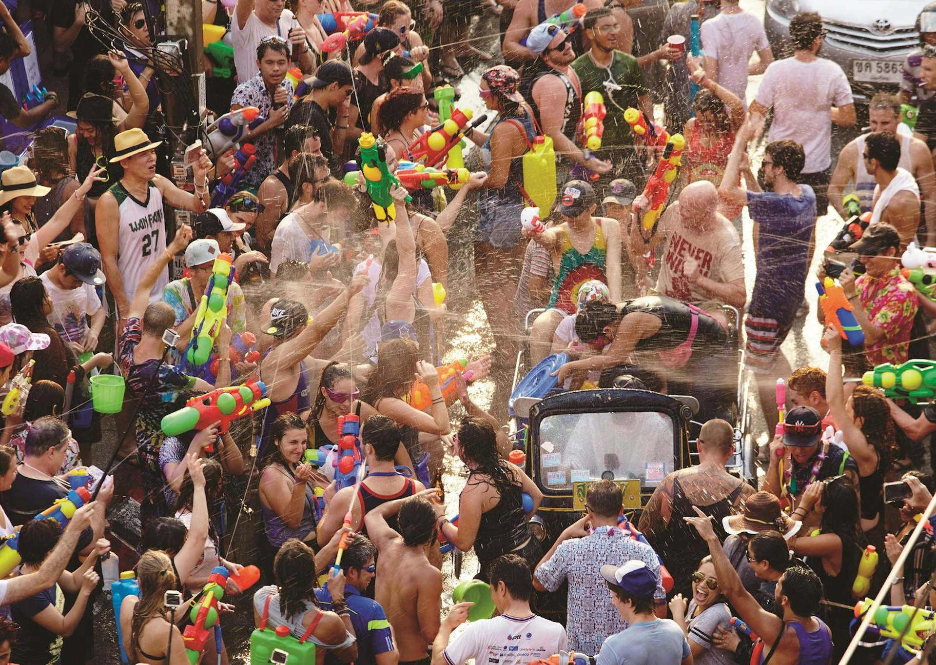 People soaking each other with water during Songkran Festival © Matt Munro / Lonely Planet
