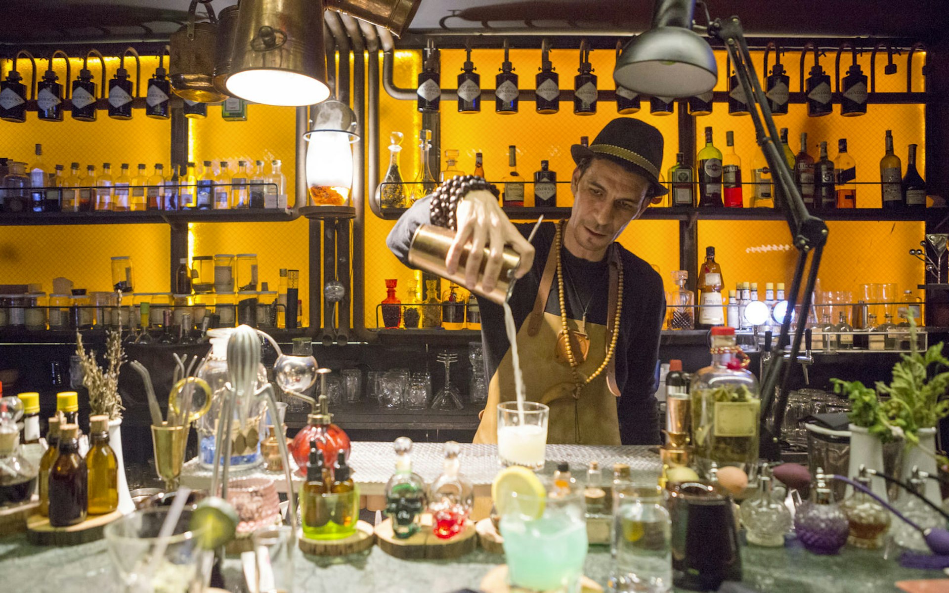 Bartender pouring drinks at Barometre Marrakesh, Morocco