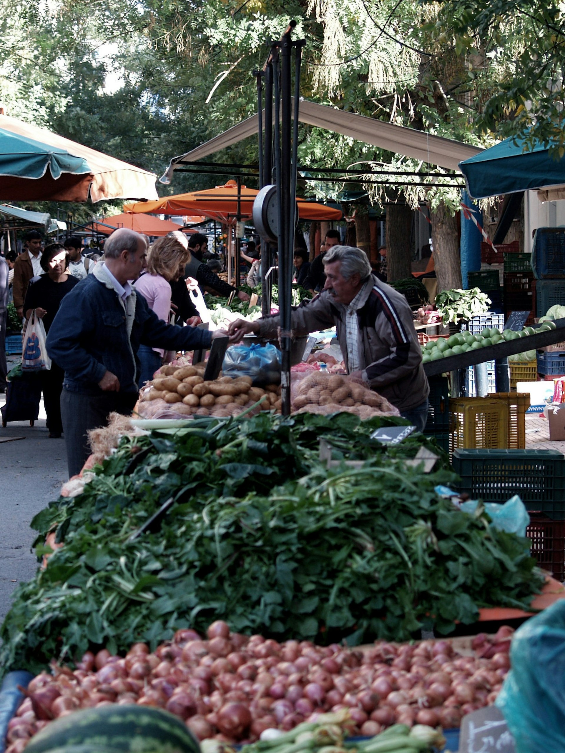 Typical scene at a weekly farmers' market on the streets of Athens © Vangelis Koronakis / Lonely Planet