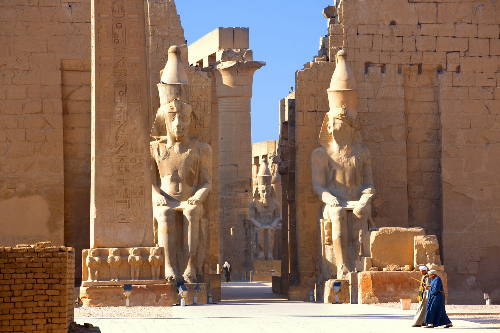 Colossal statues of Ramses II at Luxor Temple, Egypt. Image by Visions Of Our Land / Getty Images
