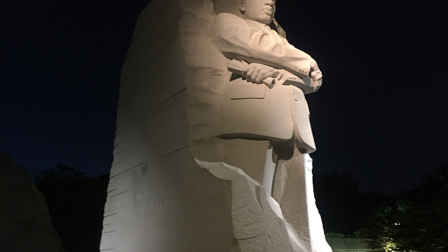 The Martin Luther King, Jr memorial on the National Mall in Washington, DC is presented at night in profile