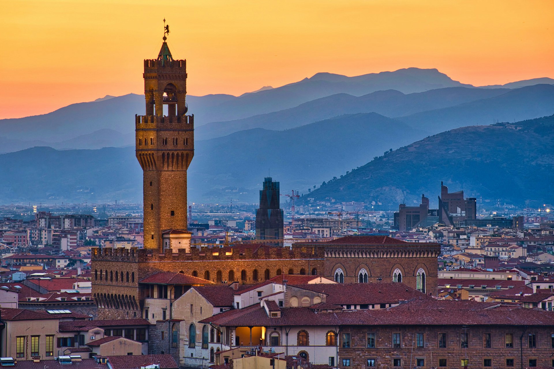 The Palazzo Vecchio's Torre d'Arnolfo towers over Florence at sunset