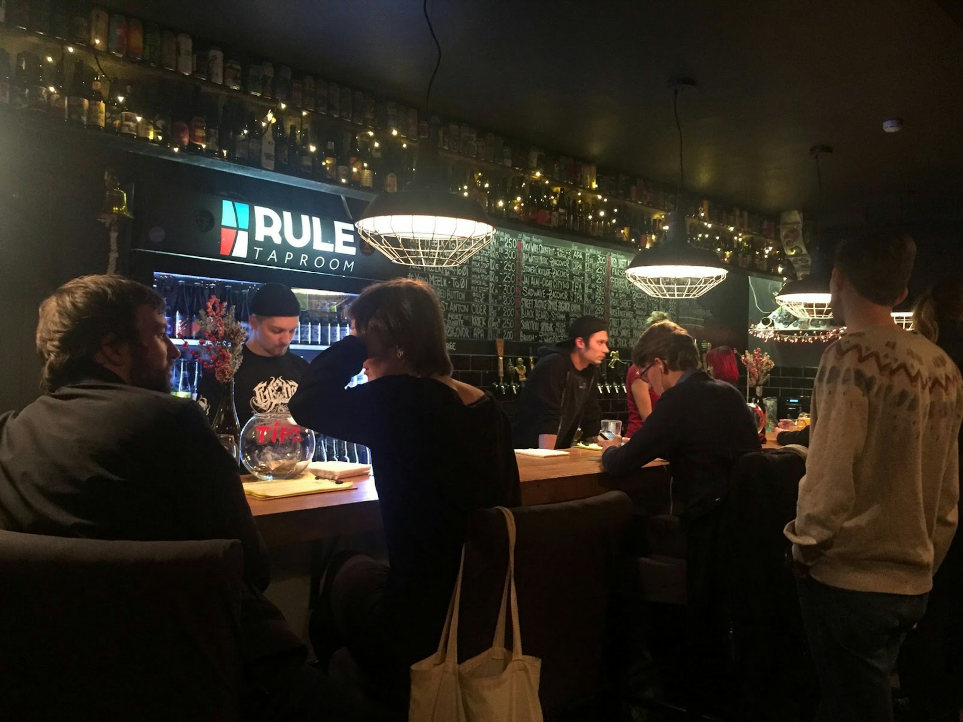 Locals cosying up to the bar at Rule Taproom in Moscow © Megan Eaves / Lonely Planet