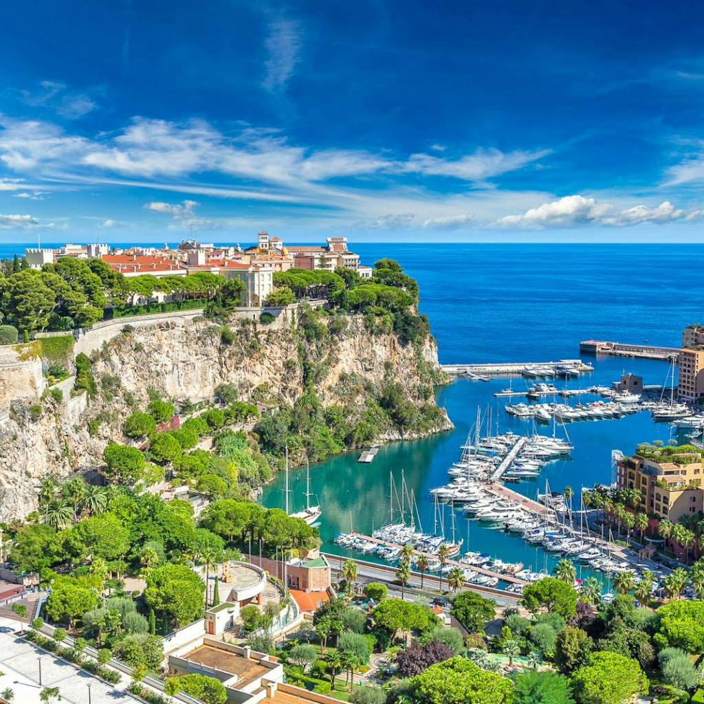 A panoramic view across Monaco taking in the harbour, the hills and the Prince's Palace of Monaco