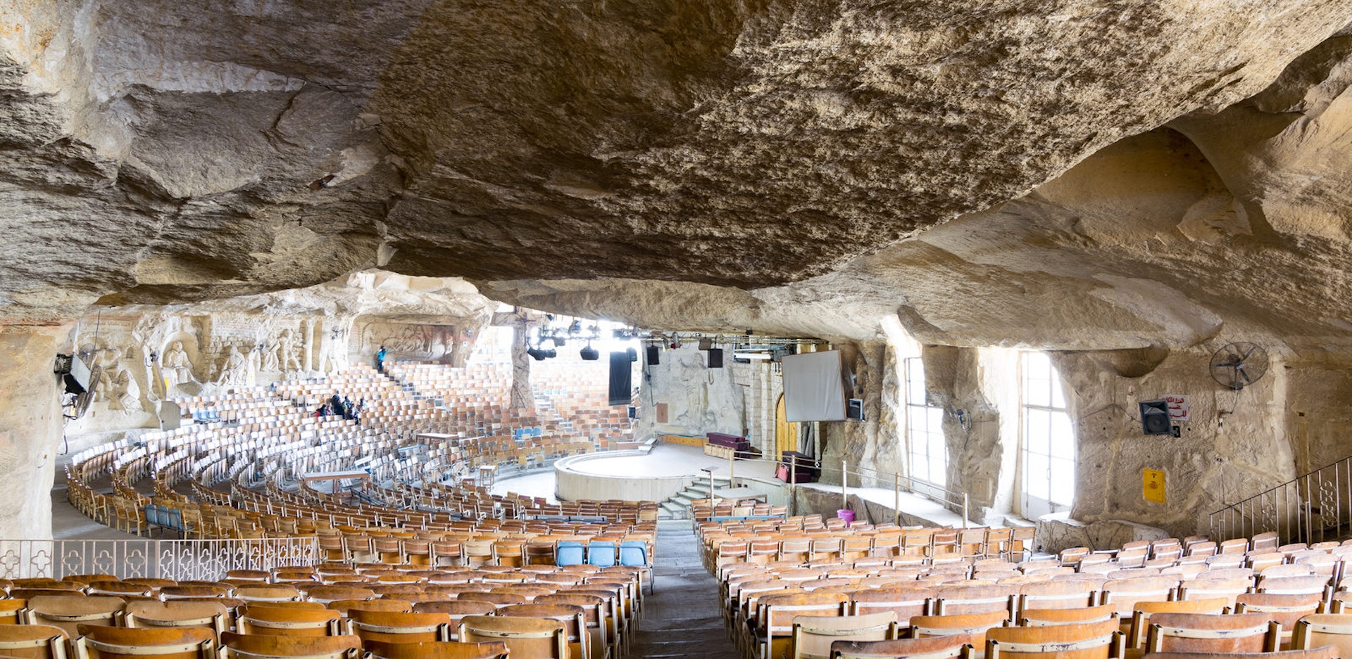 Church of St Simeon the Tanner with murals engraved on the rocks representing stories from the Bible, part of a huge cave in Saint Simeon The Tanner Monastery. Image by Khaled ElAdawy / Shutterstock