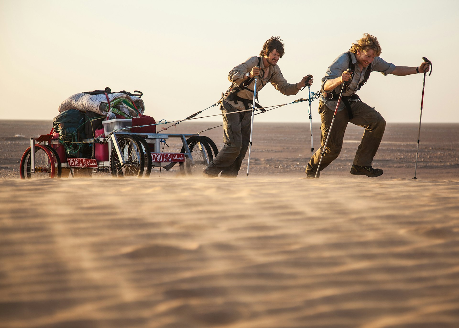Alastair Humphreys and a fellow adventurer hauling their gear across Arabia's fabled Empty Quarter © Alastair Humphreys
