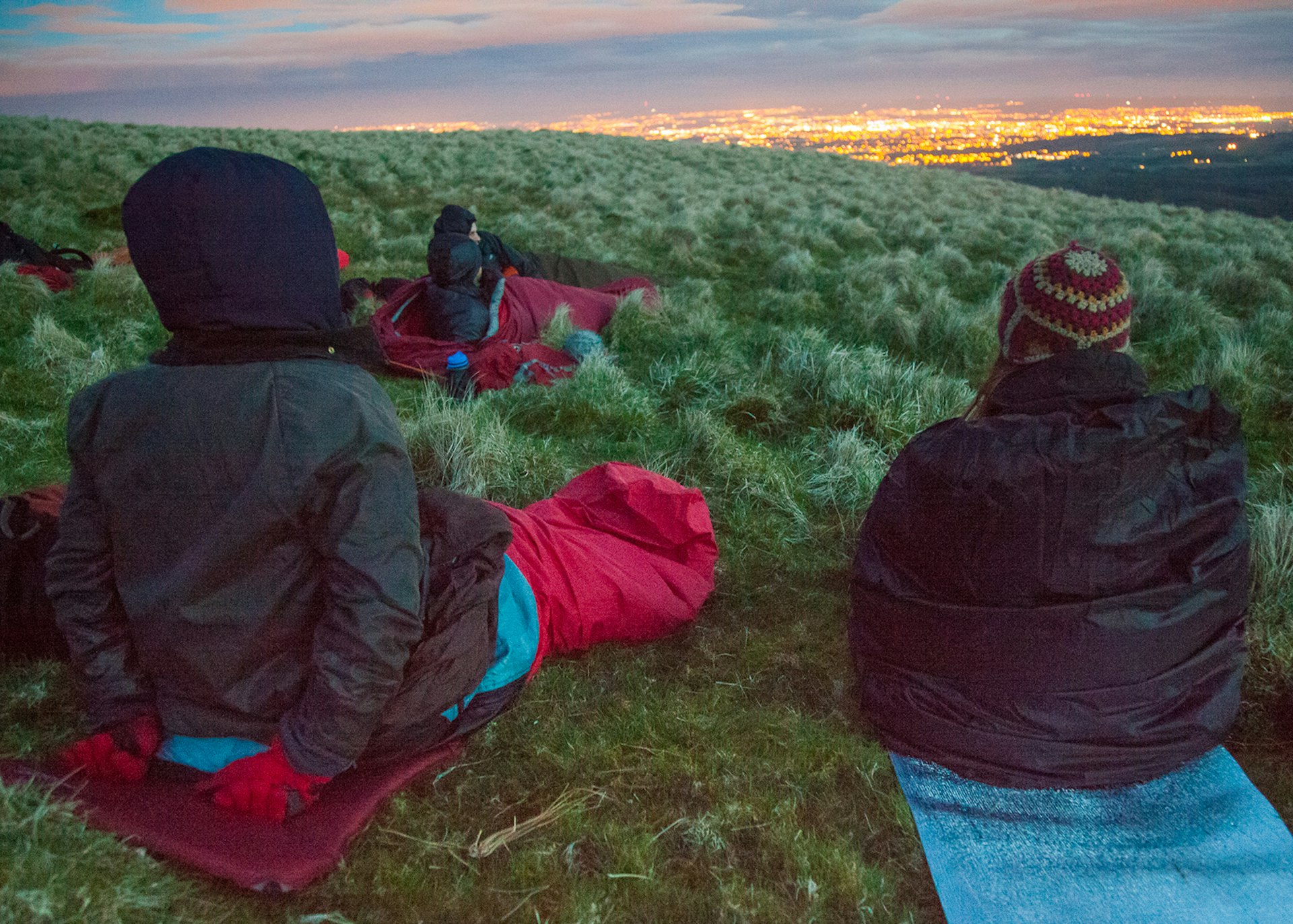 Alastair Humphreys and others wake up to watch dusk fall as they prepare to sleep on a hill © Alastair Humphreys