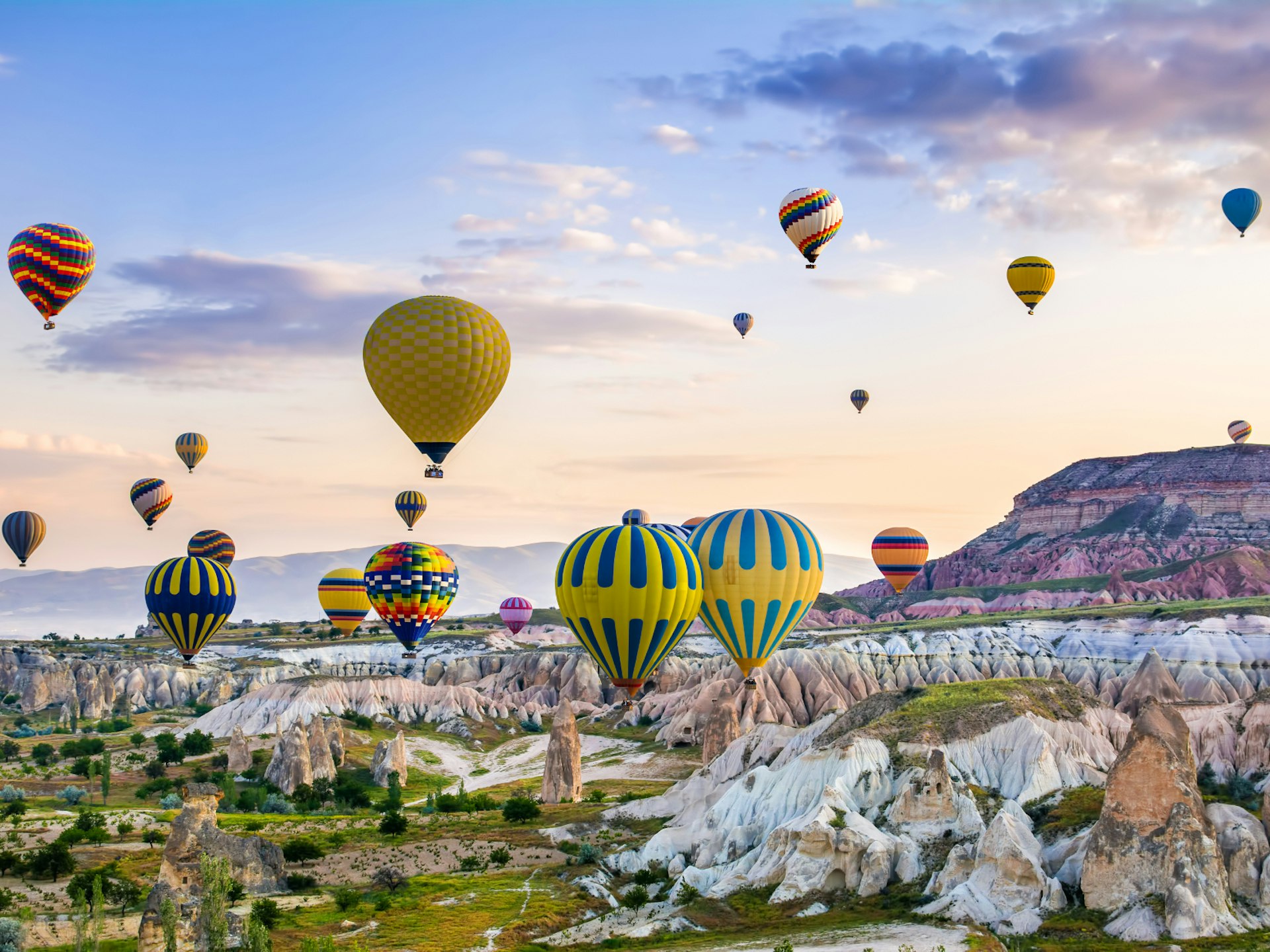 Hot-air balloons over the rocky landscape of Cappadocia, Turkey