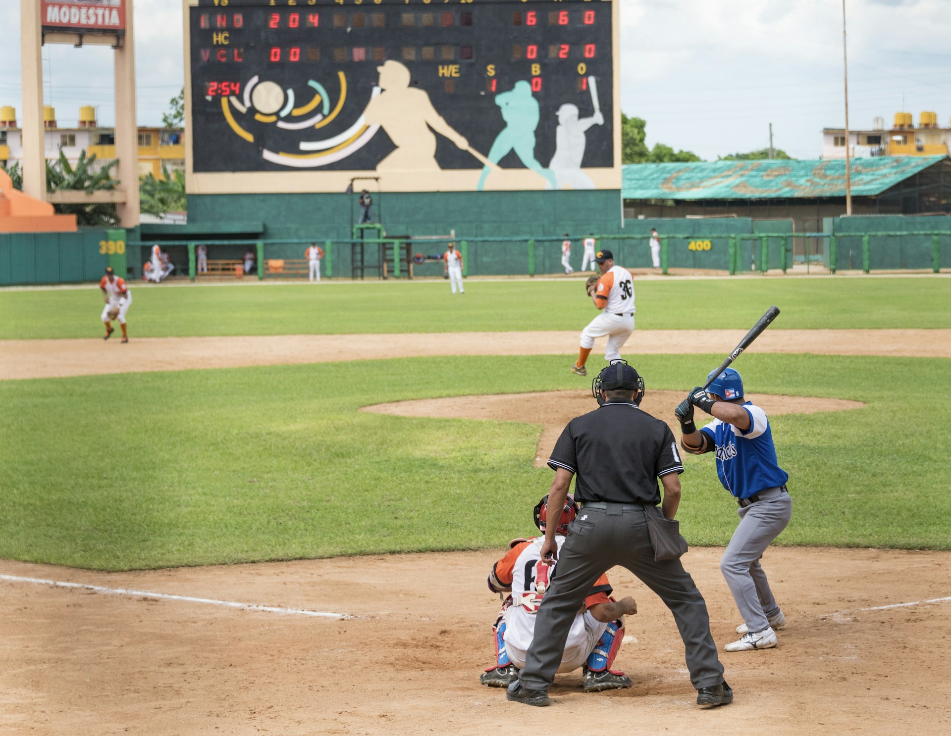 One of Cuba's oldest baseball organizations, Industriales (player in blue), is one of the most loved and hated teams in the country. Roberto Machado Noa/LightRocket via Getty Images 