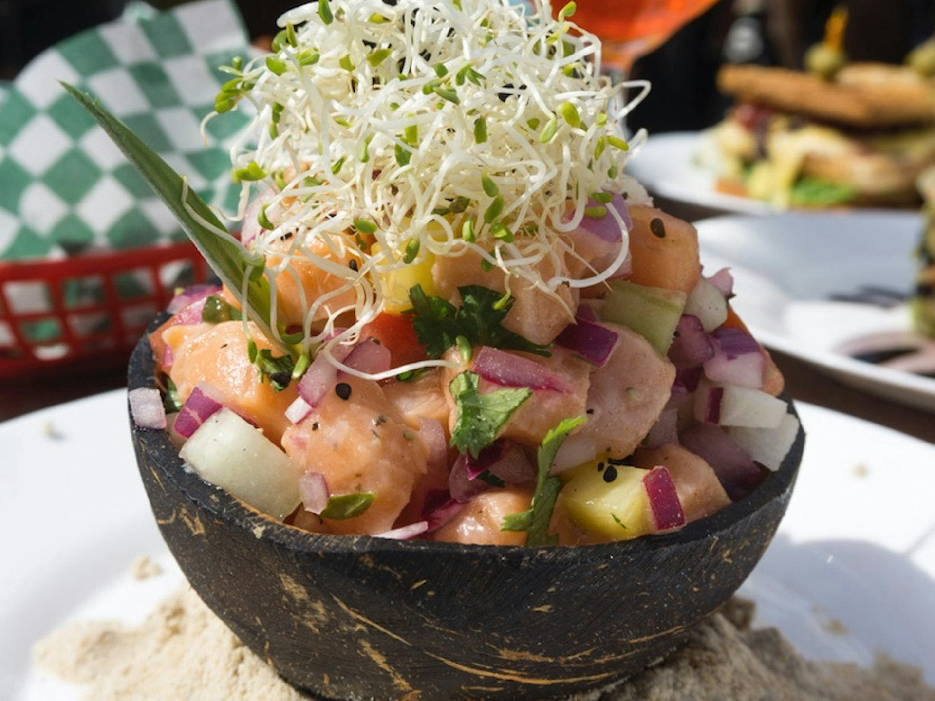 A bowl of ceviche served on the beach in Mexico