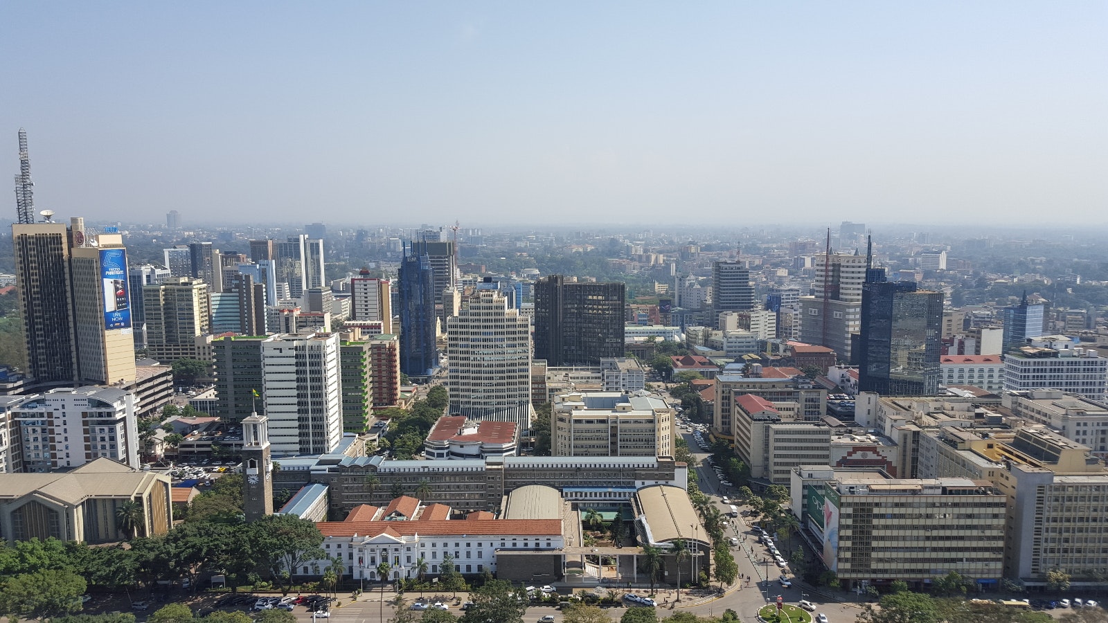 Beneath a blue sky sits the many tall buildings of central Nairobi, as seen from the lofty vista on the helicopter pad of the Kenya International Convention Centre © Clementine Logan / Lonely Planet