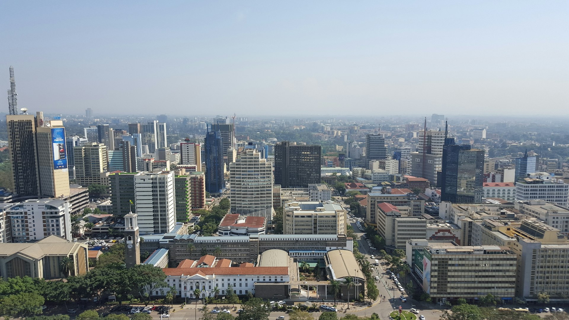 Beneath a blue sky sits the many tall buildings of central Nairobi, as seen from the lofty vista on the helicopter pad of the Kenya International Convention Centre © Clementine Logan / Lonely Planet