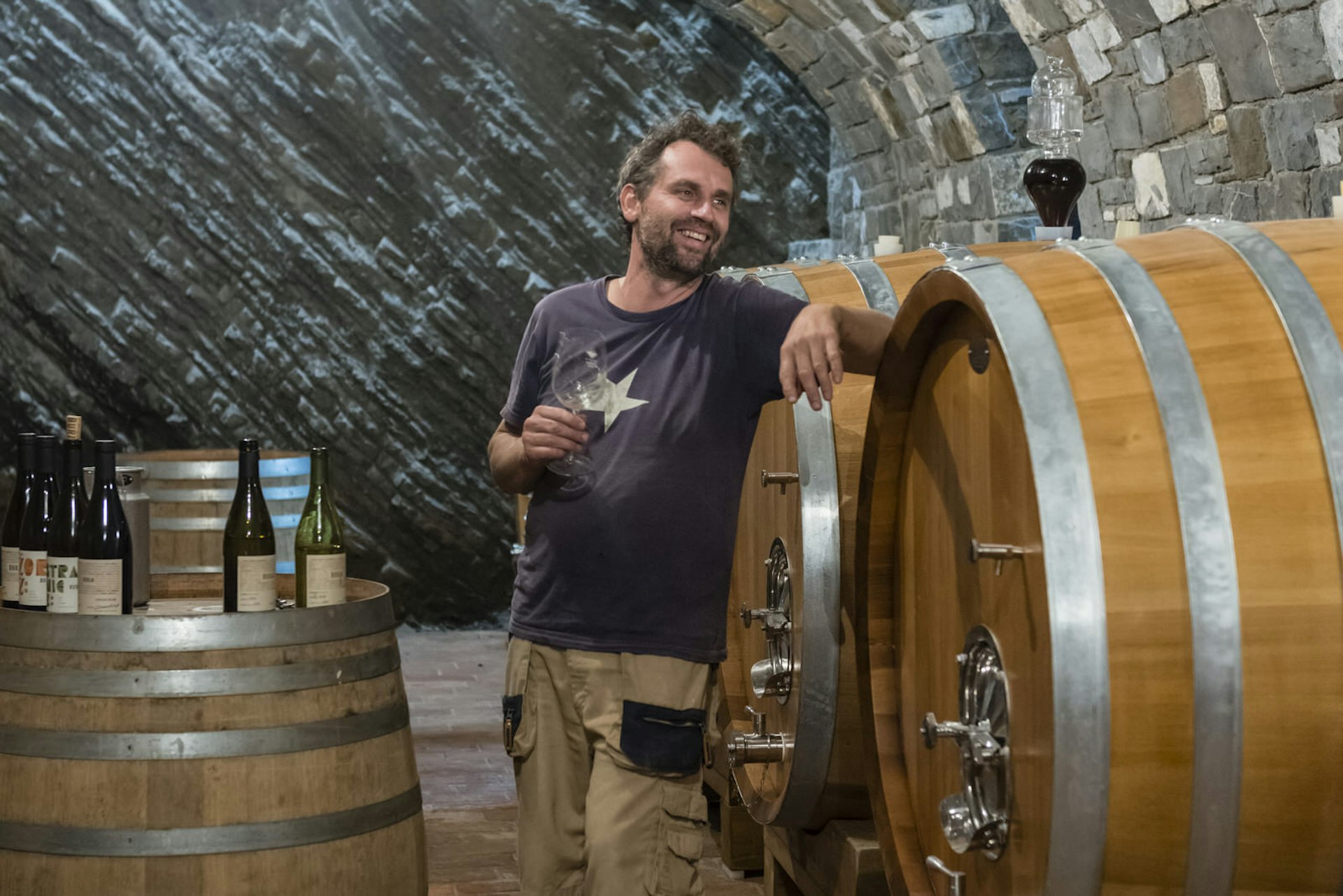 Winemaker Primoz Lavrenčič leads a wine-tasting in his wine cellar © Justin Foulkes / Lonely Planet