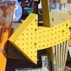 Close up view of dusty, old Las Vegas neon signs in a state of disrepair in a junkyard