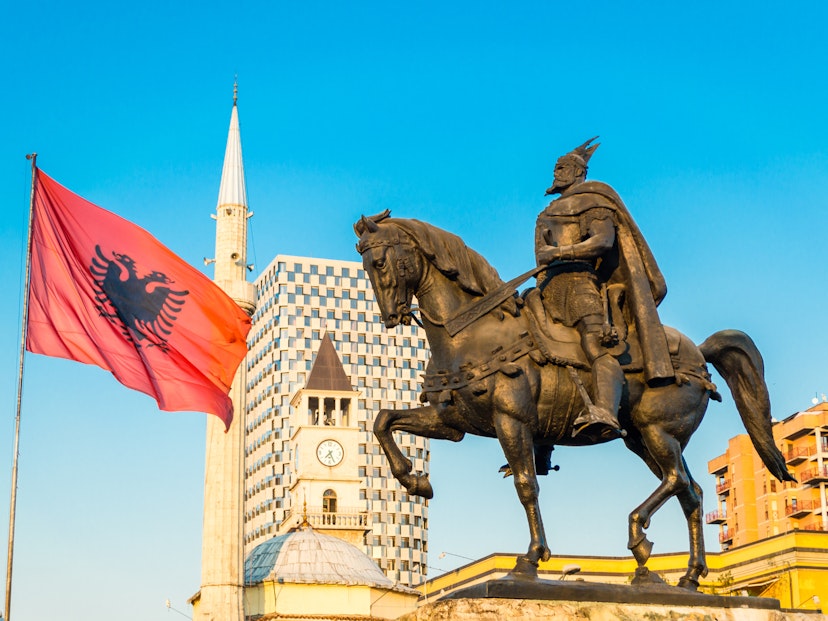Tirana's central square with the Skanderbeg monument and Et'hem Bey Mosque @ Andrii Lutsyk / Shutterstock