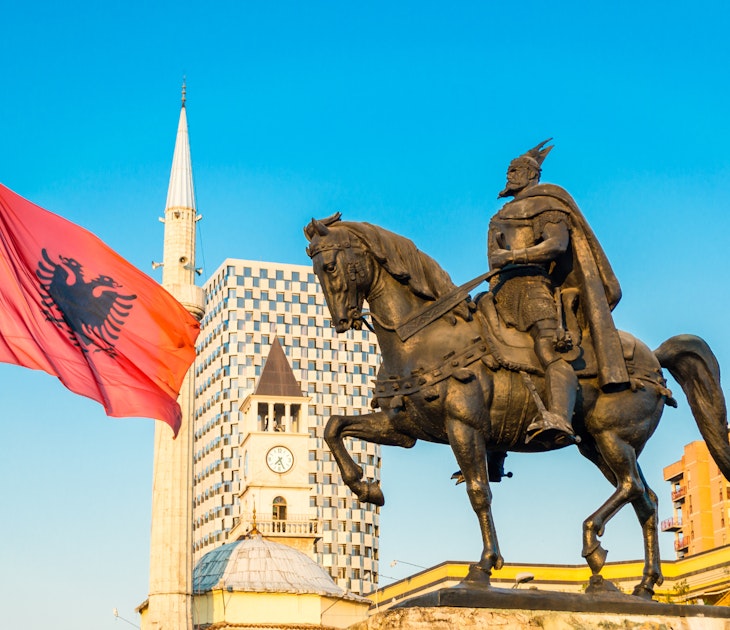 Tirana's central square with the Skanderbeg monument and Et'hem Bey Mosque @ Andrii Lutsyk / Shutterstock