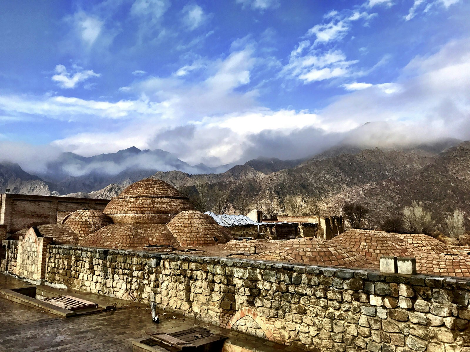 Kordasht Hammam with mountain range in the distance © Steve Waters / Lonely Planet