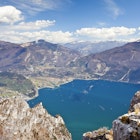Features - Climber on the Cima Rocca, via ferrata with view of Lake Garda, Riva and Nago-Torbole, Trentino, Italy, Europe