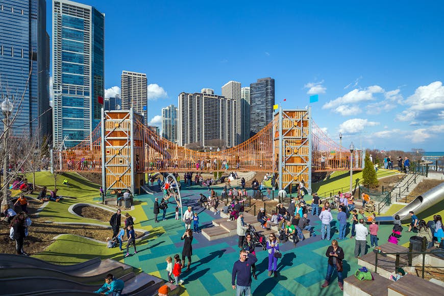 Families gather on the colorful playground at Maggie Daley Park in downtown Chicago